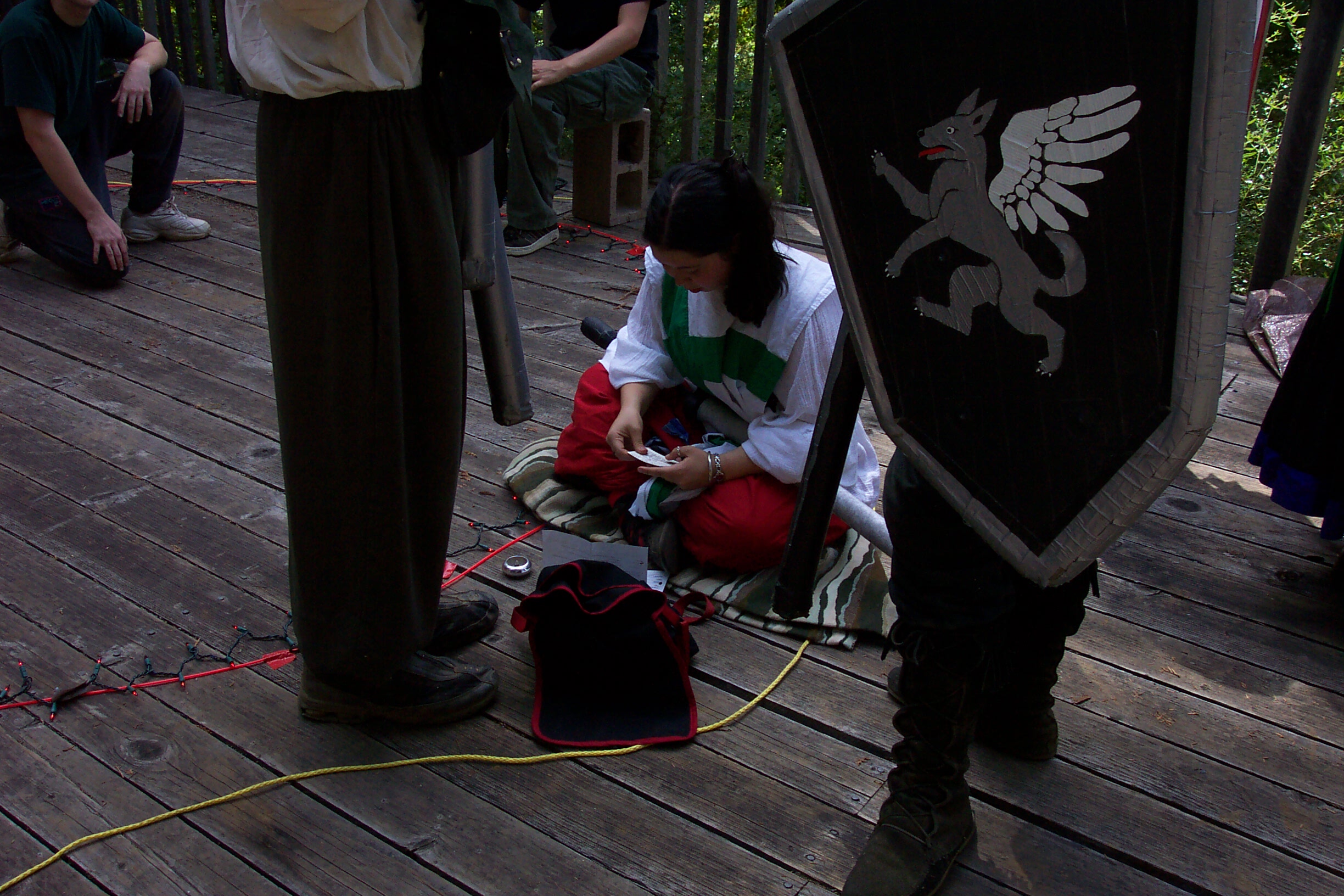 Liandrin prepares her scrolls and components for the formal magic.