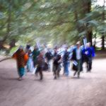 Adventurers march along the road.