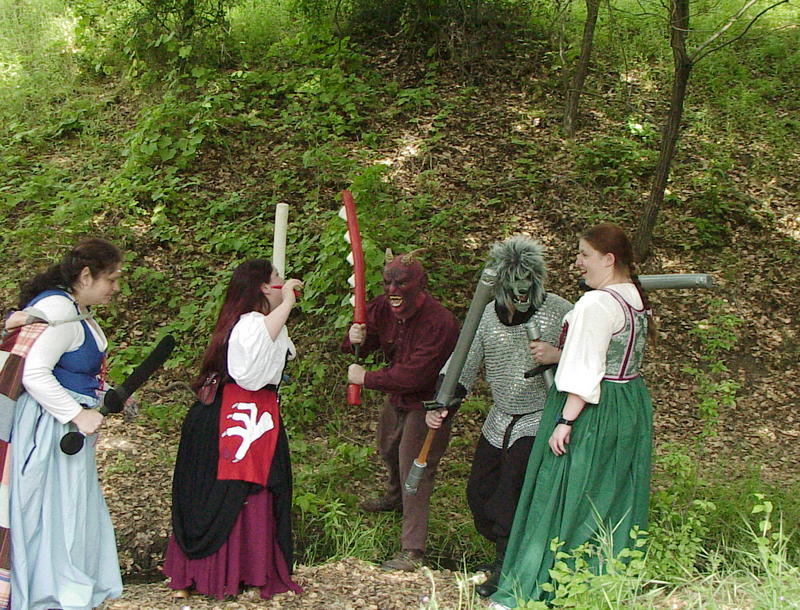 Beryl, Liandrin, and Valia face off against a fire elemental and a gnoll.